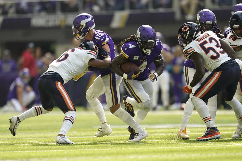 Minnesota Vikings running back Dalvin Cook runs from Chicago Bears linebacker Nicholas Morrow during the first half, Sunday, Oct. 9, 2022, in Minneapolis.
