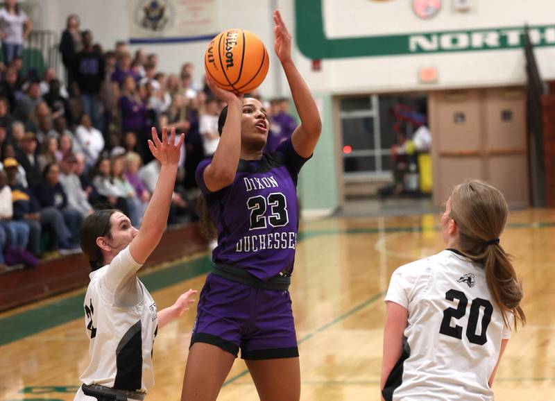 Dixon’s Ahmyrie McGowan shoots between two Kaneland defenders during their Class 3A sectional semifinal game Tuesday, Feb. 25, 2025, at Boylan Catholic High School in Rockford.