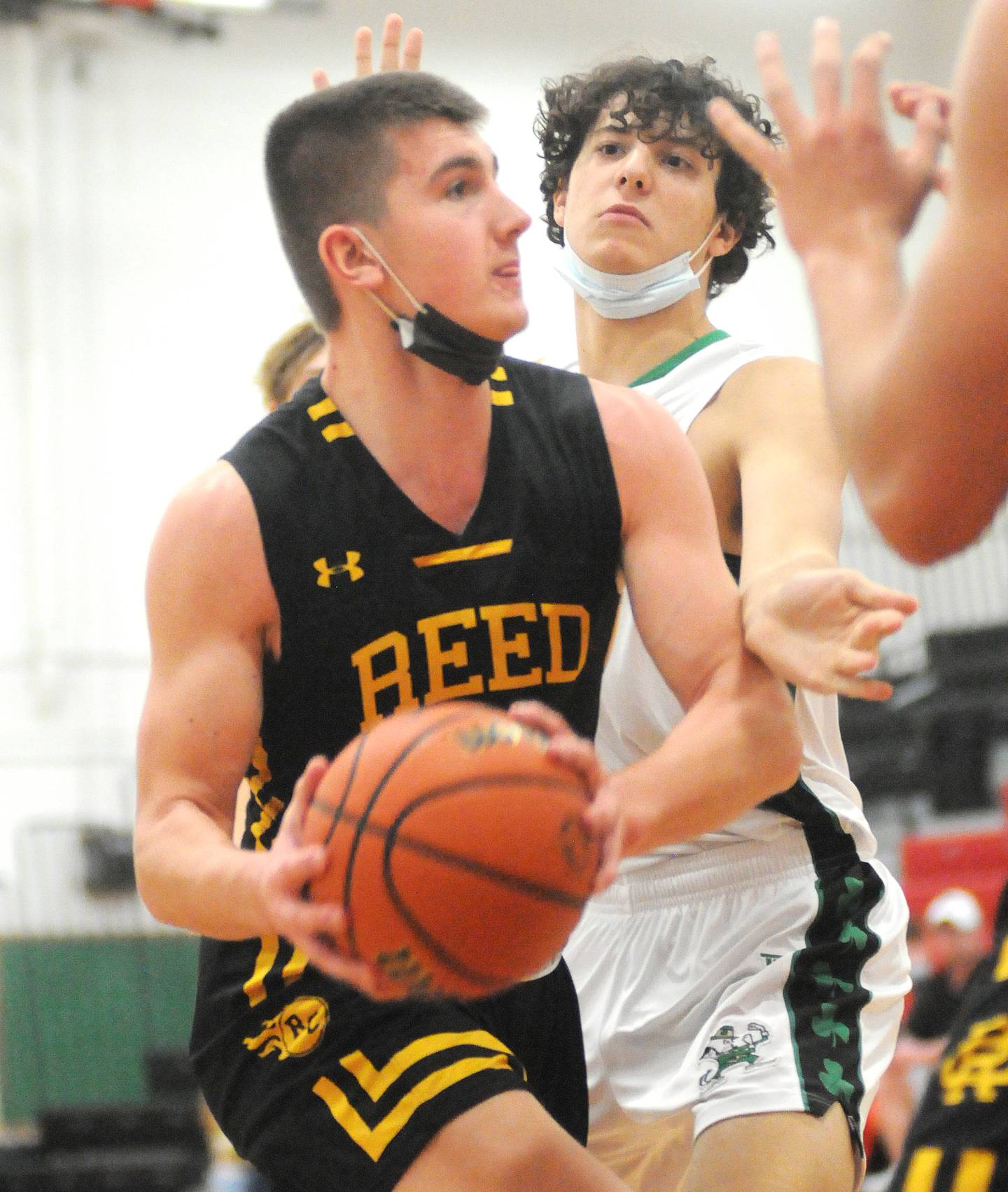 Reed-Custer's Lucas Foote shoots as Seneca's Dominic Traina defends in the Marseilles Holiday Tournament semifinals on Wednesday, Dec. 29, 2021.