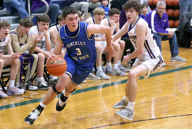 Hinckley-Big Rock's Ben Hintzsche drives around Serena's Hunter Staton Friday, Feb. 3, 2023, during the championship game of the Little 10 Conference Basketball Tournament at Somonauk High School.