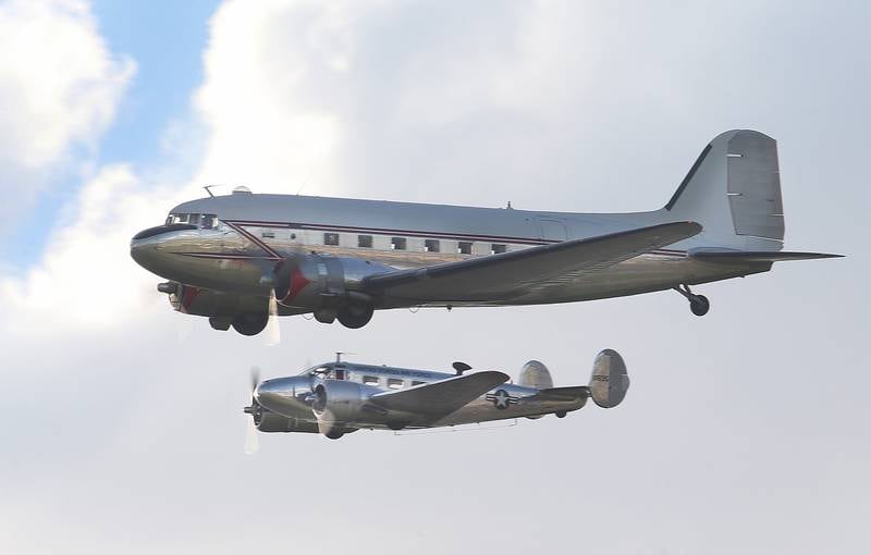 A Dougles DC-3 aircraft flys with a Twin Beech Model 18 during the 10th annual TBM Avenger Reunion and Airshow on Friday, May 16, 2025 at the Illinois Valley Regional Airport in Peru.