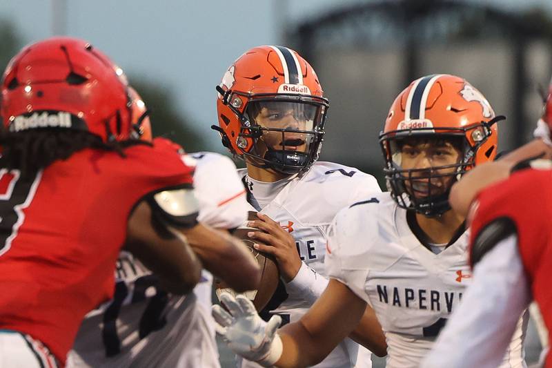 Naperville North’s Jacob Bell looks to pass against Bolingbrook on Friday, Sept. 8, 2023 in Bolingbrook.