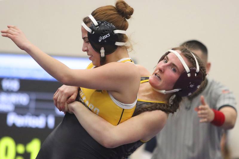 Richmond-Burton’s Breanna Warren, back throws Harvard’s Giada Reising at 115 pounds in IHSA Regional wrestling action on Saturday, Feb. 1, 2025, at  Hampshire High School  in Hampshire.