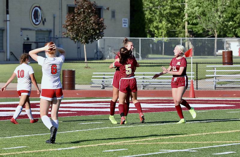 Morris' Fran Cummings and Lauren Shear (5) celebrate Cummings' goal Friday, June 4, 2021, in a 2-0 win over Streator as teammate Emilia Marino joins in.