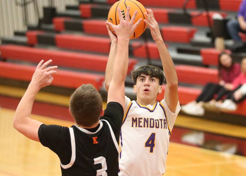 Mendota's Johan Cortez shoots a jump shot over Kewanee's Greyden Lewis during the 50th annual Colmone Classic on Thursday, Dec. 12, 2024 at Hall High School.