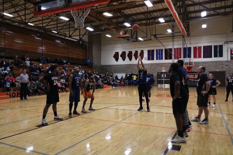 Marcus Jones shoots from the charity stripe Monday, Dec. 2, 2024, at the annual charity basketball game held at Huntley Middle School in DeKalb.