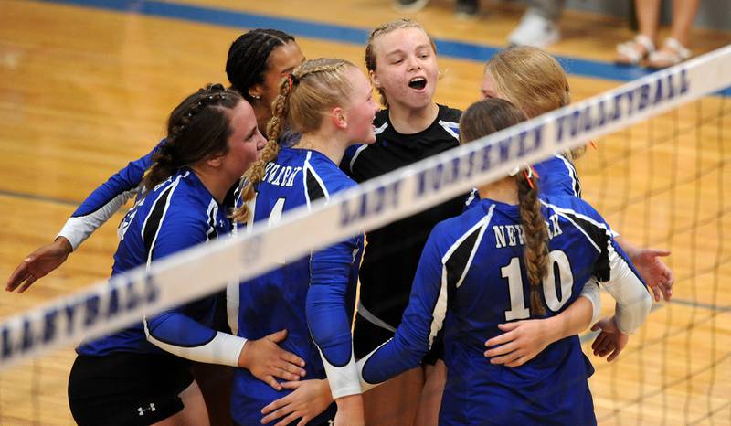 The Newark girls celebrate a point against Aurora Christian during a girls' volleyball match at Newark High School on Tuesday, Sep. 5, 2023.