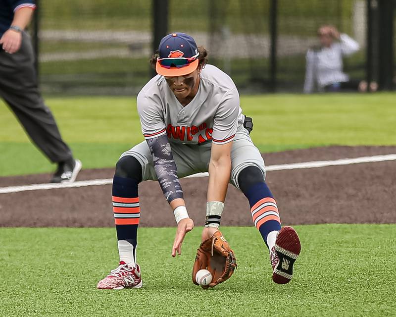 Oswego's Trey Hernandez (14) fields a grounder during the Class 4A Romeoville Sectional final game between Plainfield North at Oswego.  June 4, 2022.