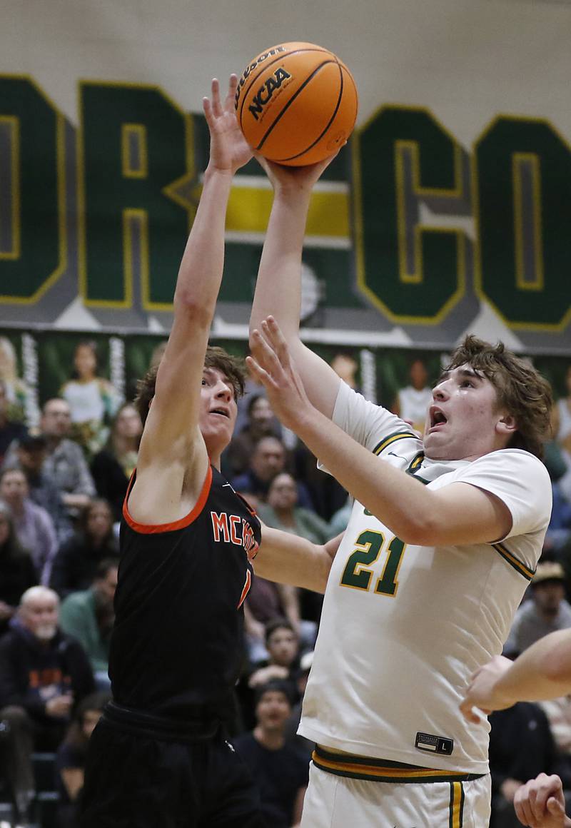 Crystal Lake South's Ryan Morgan drives to the basketball against McHenry's Dylan Hurckes during a Fox Valley Conference basketball game on Friday, Jan. 31, 2025, at Crystal Lake South High School.