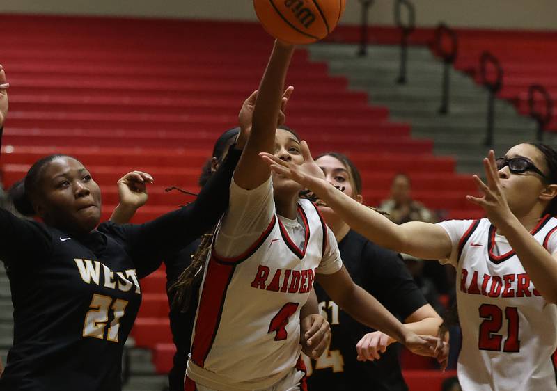 Bolingbrook’s Sydney Dodd reaches for the rebound against Joliet West on Thursday, Jan 23, 2025 in Bolingbrook.