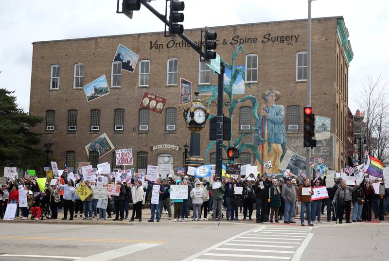 Hundreds of people assembled Saturday, April 5, 2025, for a Hands Off! rally at Memorial Park on the corner of First Street and Lincoln Highway in DeKalb. The group gathered to protest against various policies of President Donald Trump and his administration.