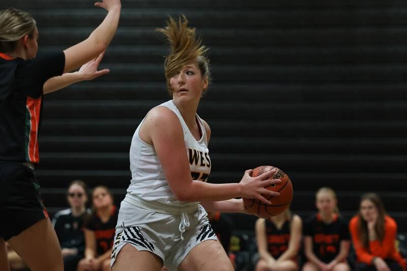 Joliet West’s Brook Schwall looks for a play against Plainfield East on Thursday, February 2nd.