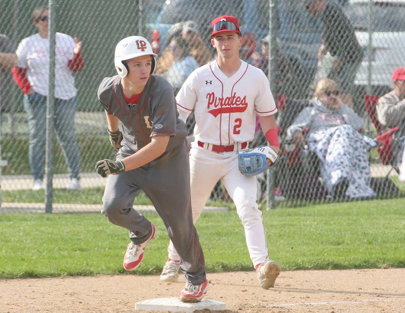 L-P's Braylin Bond looks to run home as Ottawa's Jacob Rosetto covers the bag on Friday, May 2, 2025 at Ottawa High School.