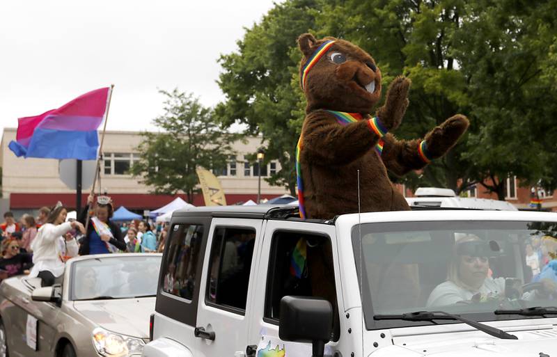 Woodstock Willie waves to the crowd during the Woodstock PrideFest Parade Sunday, June 11, 2023, around the historic Woodstock Square.