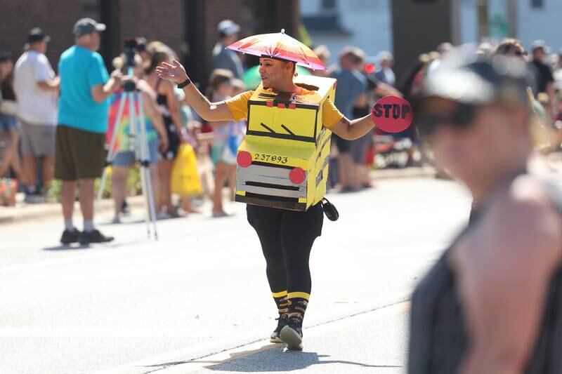 A First Student employee dressed as a school bus walks along in the Manhattan Labor Day Parade on Monday, Sept. 4, 2023 in Manhattan.