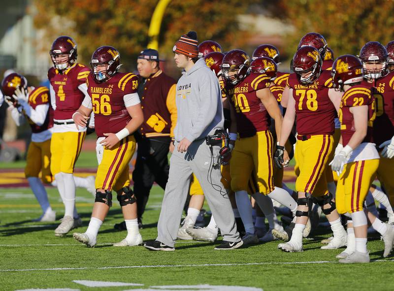 Loyola's James Kyle leads the team back on the field after halftime of the IHSA Class 8A varsity football semifinal playoff game