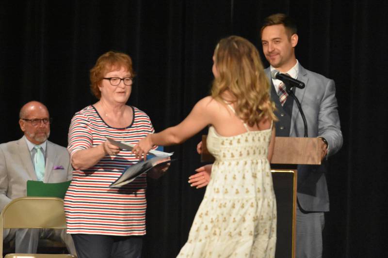 Scholarship Administrator, Gayle Reno, hands out the Elmer and Adolph Pletsch Scholarship to Linzee Fay.