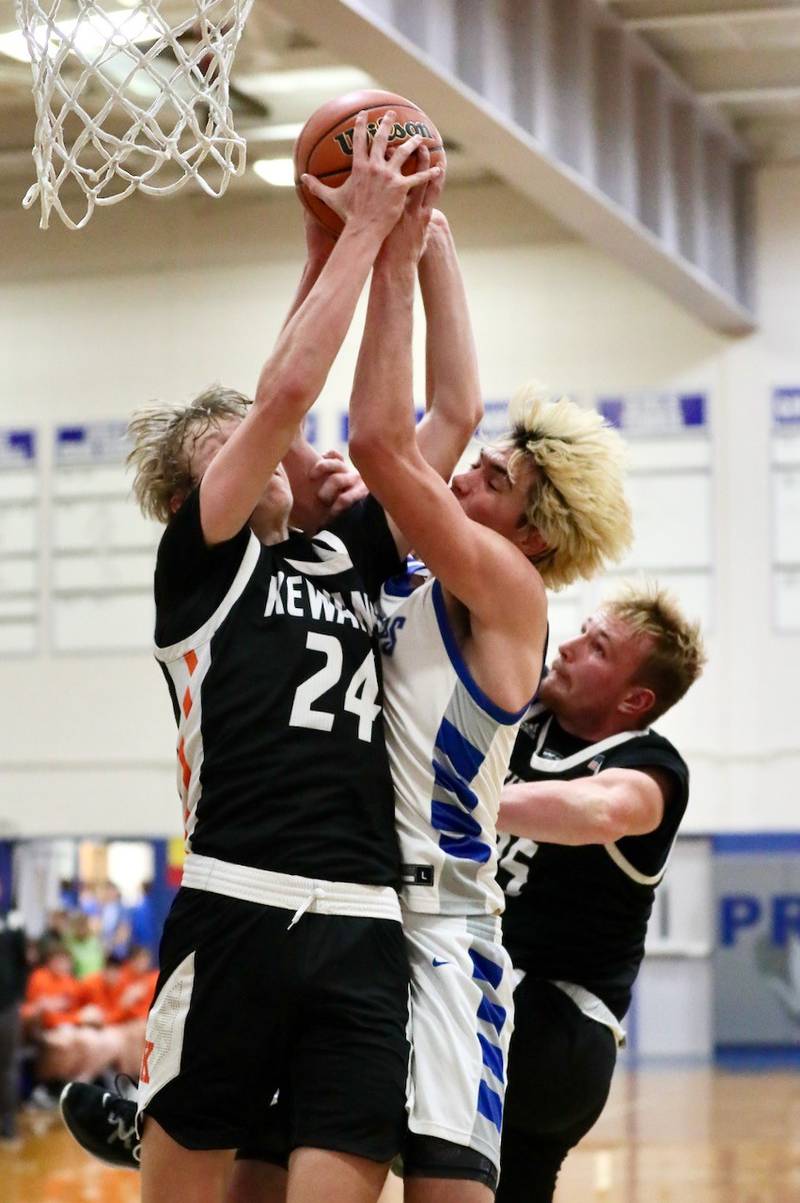 Princeton's Noah LaPorte battles Kewanee Brady Clark for a rebound Tuesday night at Prouty Gym. The Tigers won 61-55.