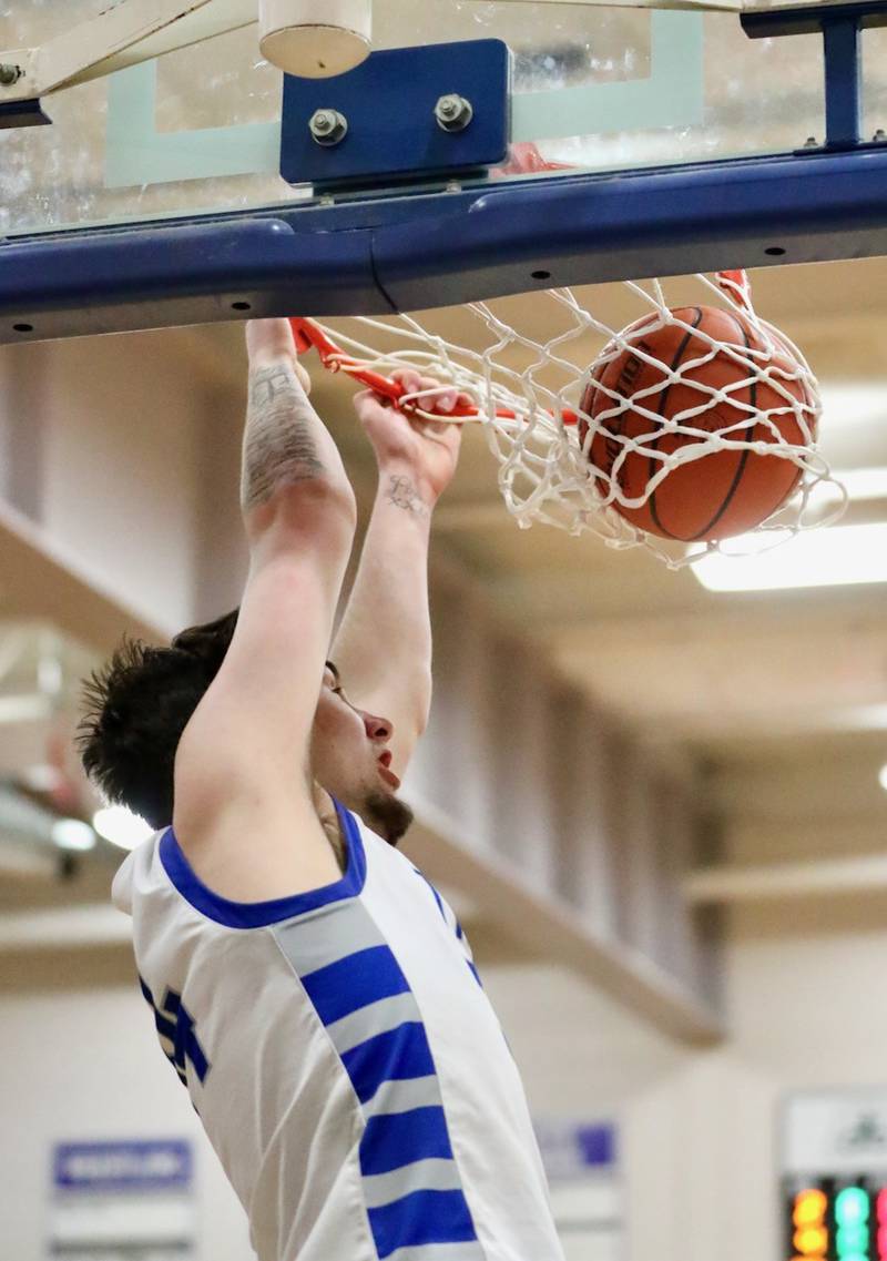 Princeton's Kolten Monroe throws down a dunk in the first quarter against St. Bede Friday night at Prouty Gym.