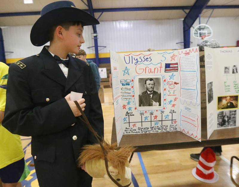 Kipton Gutshall dresses as Ulysses S. Grant during the live Wax Museum on Thursday, Feb. 27, 2025 at Logan Jr. High School in Princeton. Students made poster boards and dressed like their featured character at the event.