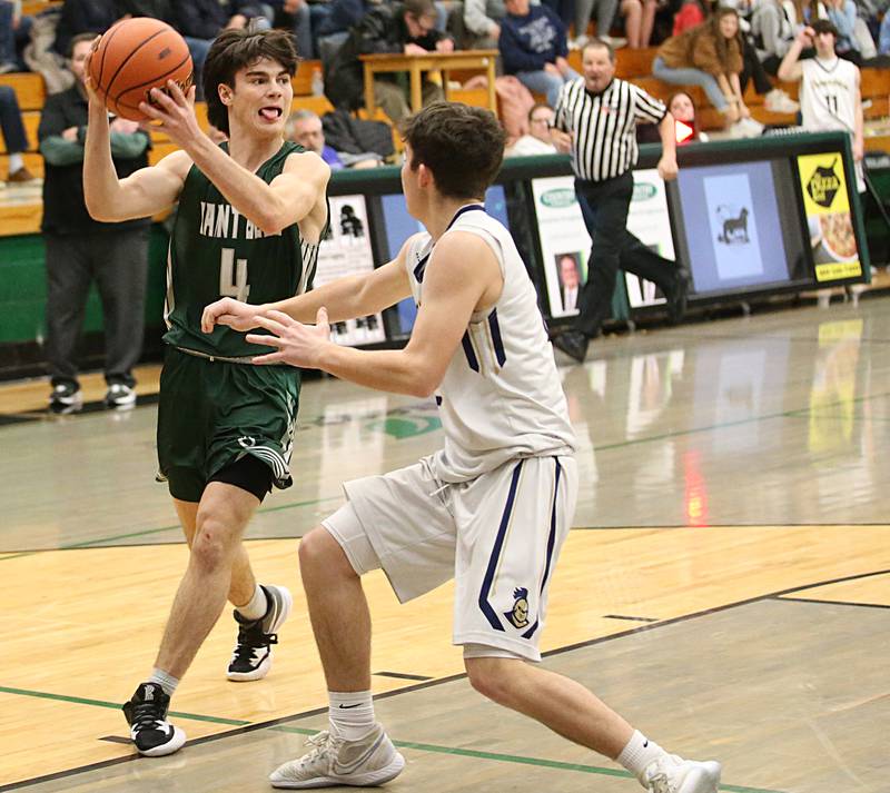 St. Bede's John Brady looks to pass the ball over Marquette's Carson Zellers in the Class 1A Regional semifinal on Wednesday, Feb. 22, 2023 at Midland High School.