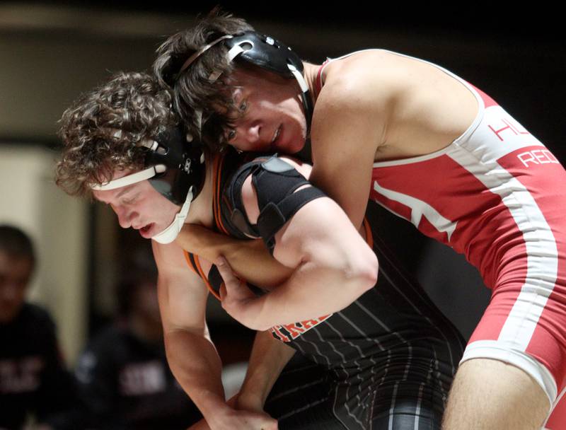 Crystal Lake Central’s  Brett Campagna, left, battles Huntley’s Vlad Maluhin in a 144-pound bout in varsity wrestling at Crystal Lake Friday. Campagna won the match.