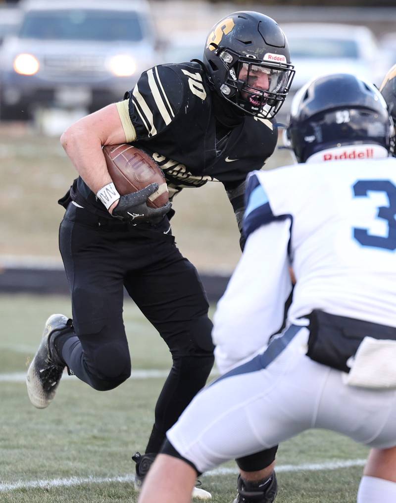 Sycamore's Zack Crawford looks for an opening in the Nazareth line Saturday, Nov. 18, 2022, during their state semifinal game at Sycamore High School.