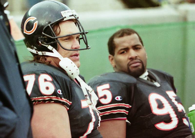 Chicago Bears defensive lieman Steve McMichael and Richard Dent defensive end, watch from the sidelines during a game in 1990. Both players are NFL Hall of Famers.