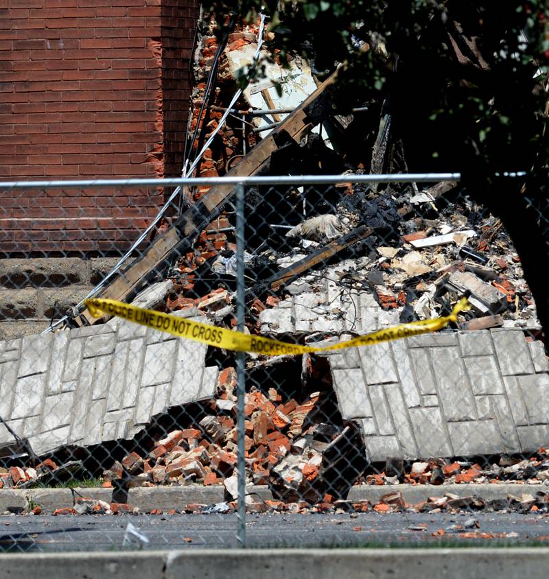 Debris from the apartment building at 406 E. Third St. in Sterling now fills the walkway between the apartment building and one to the west.