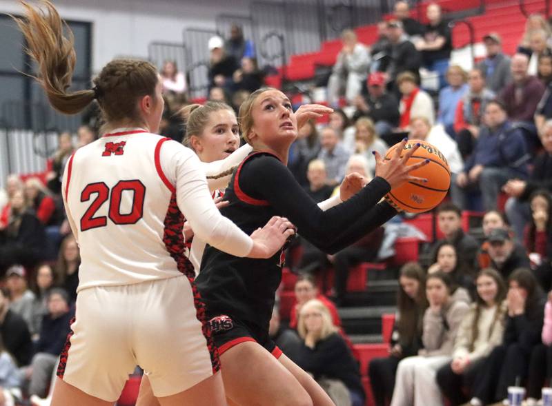 Huntley’s Anna Campanelli works under the hoop against Maine South in Komaromy Holiday Classic varsity girls basketball championship game action on Monday, Dec. 30, 2024, at Dundee-Crown High School in Carpentersville.