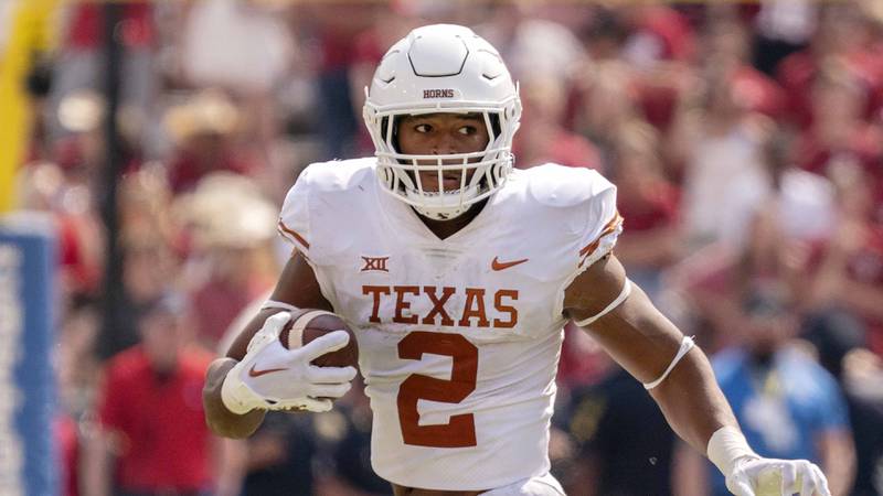 Texas running back Roschon Johnson runs upfield during the second half against Oklahoma at the Cotton Bowl, Saturday, Oct. 8, 2022, in Dallas.