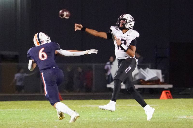 Plainfield North's Justus Byrd (13) throws a pass against Oswego’s Mikey Claycombe (6) during a football game at Oswego High School on Friday, Sept. 27, 2024.