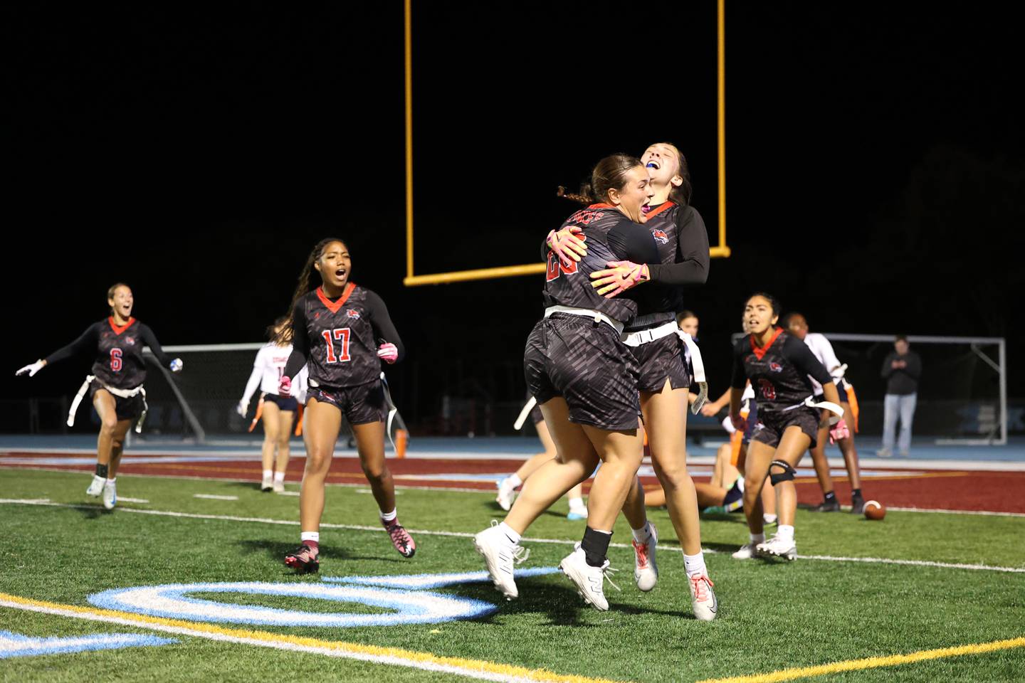 Yorkville's Kayla Kersting and Annabel West leap in celebration as the Foxes secured a 2-1 overtime victory over Oswego in the IHSA Kankakee Regional championship game on Thursday, Oct. 9, 2025.