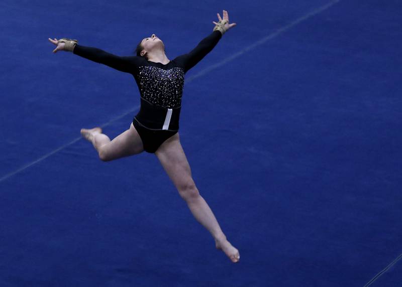 DeKalb's Annabella Simpson competes in the preliminary round of the floor exercise Friday, Feb. 17, 2023, during the IHSA Girls State Final Gymnastics Meet at Palatine High School.