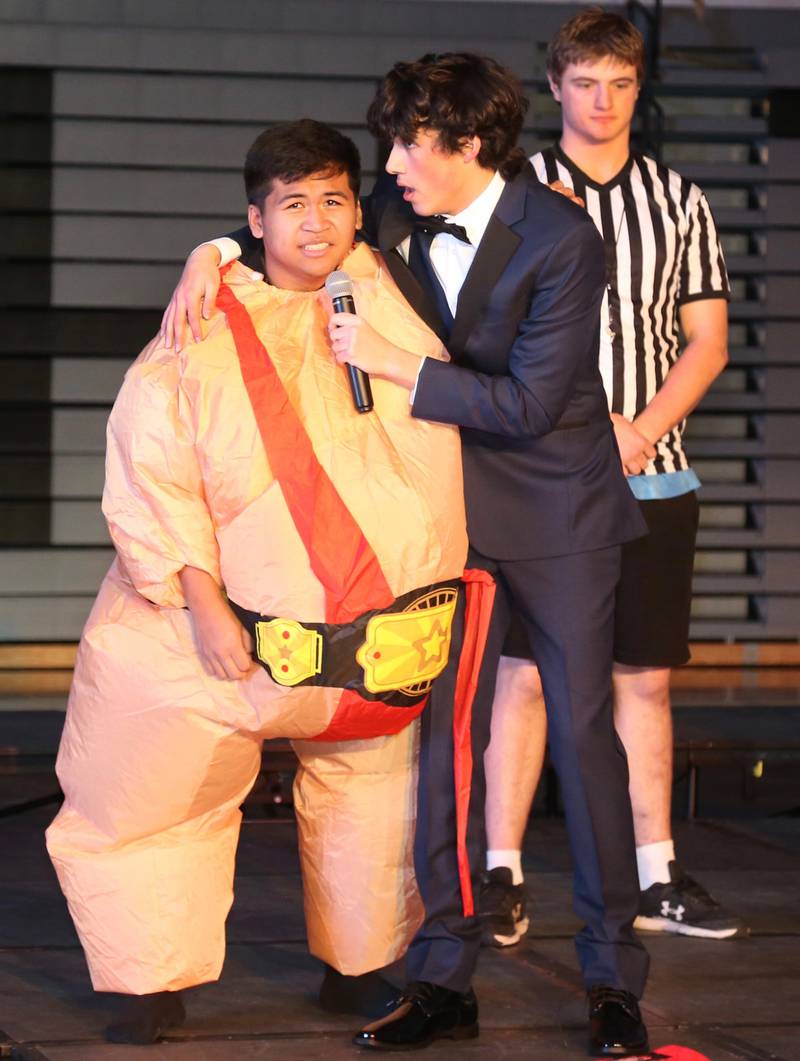 Contestants Matt Manugas and Andres Alba (left and center) perform in the Mr. Kaneland 2023 competition on Friday, March 10, 2023 in Maple Park.