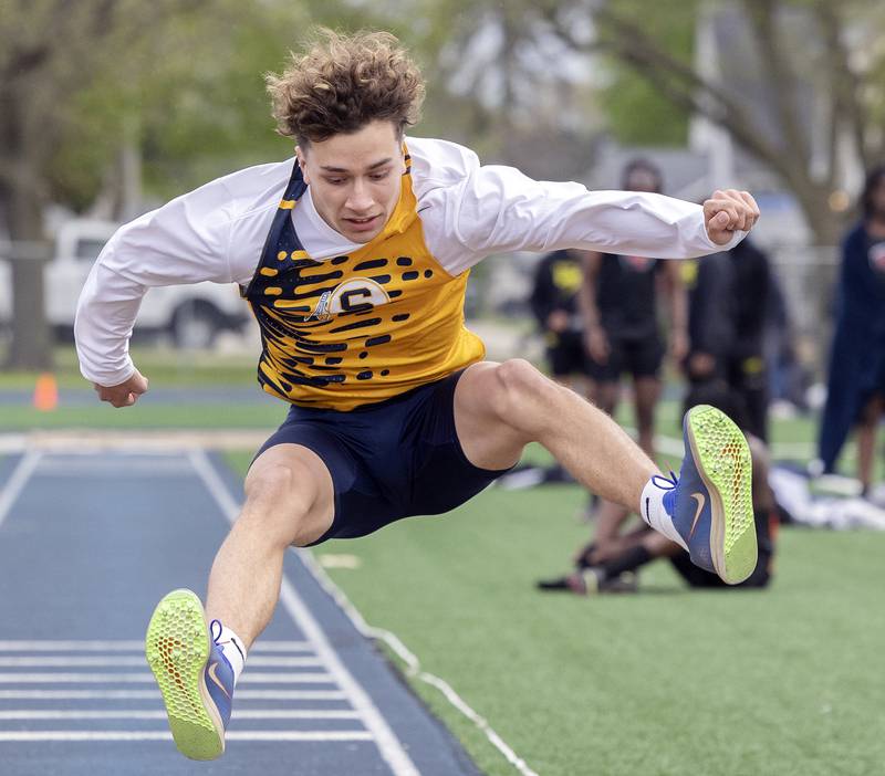 Sterling’s Kylan Reyes eyes the landing in the triple jump Friday, May 2, 2025, at the Sterling Night Relays.