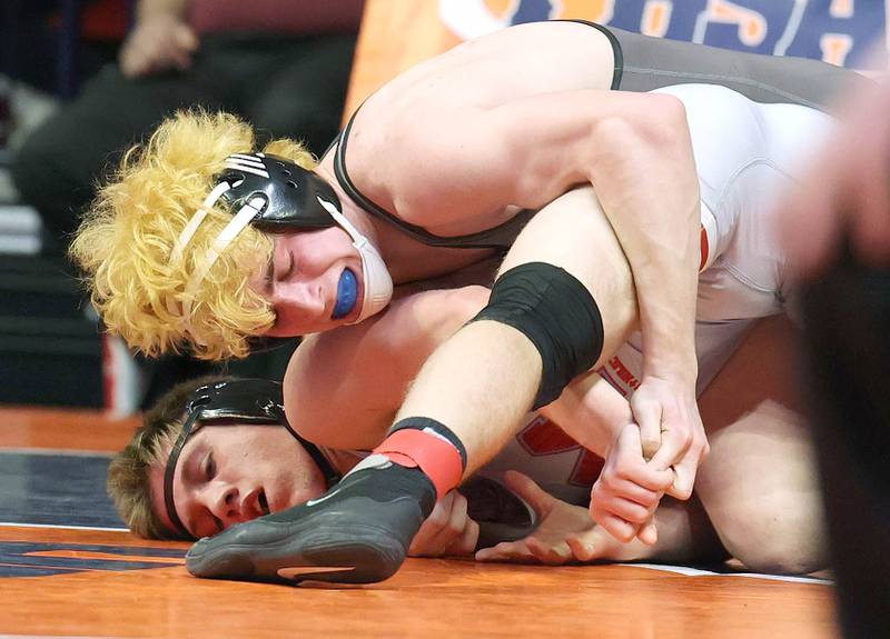 Lena-Winslow’s Garrett Luke controls Marian Central Catholic’s Ethan Struck during their Class 1A 152 pound 3rd place match Saturday, Feb. 18, 2023, in the IHSA individual state wrestling finals in the State Farm Center at the University of Illinois in Champaign.