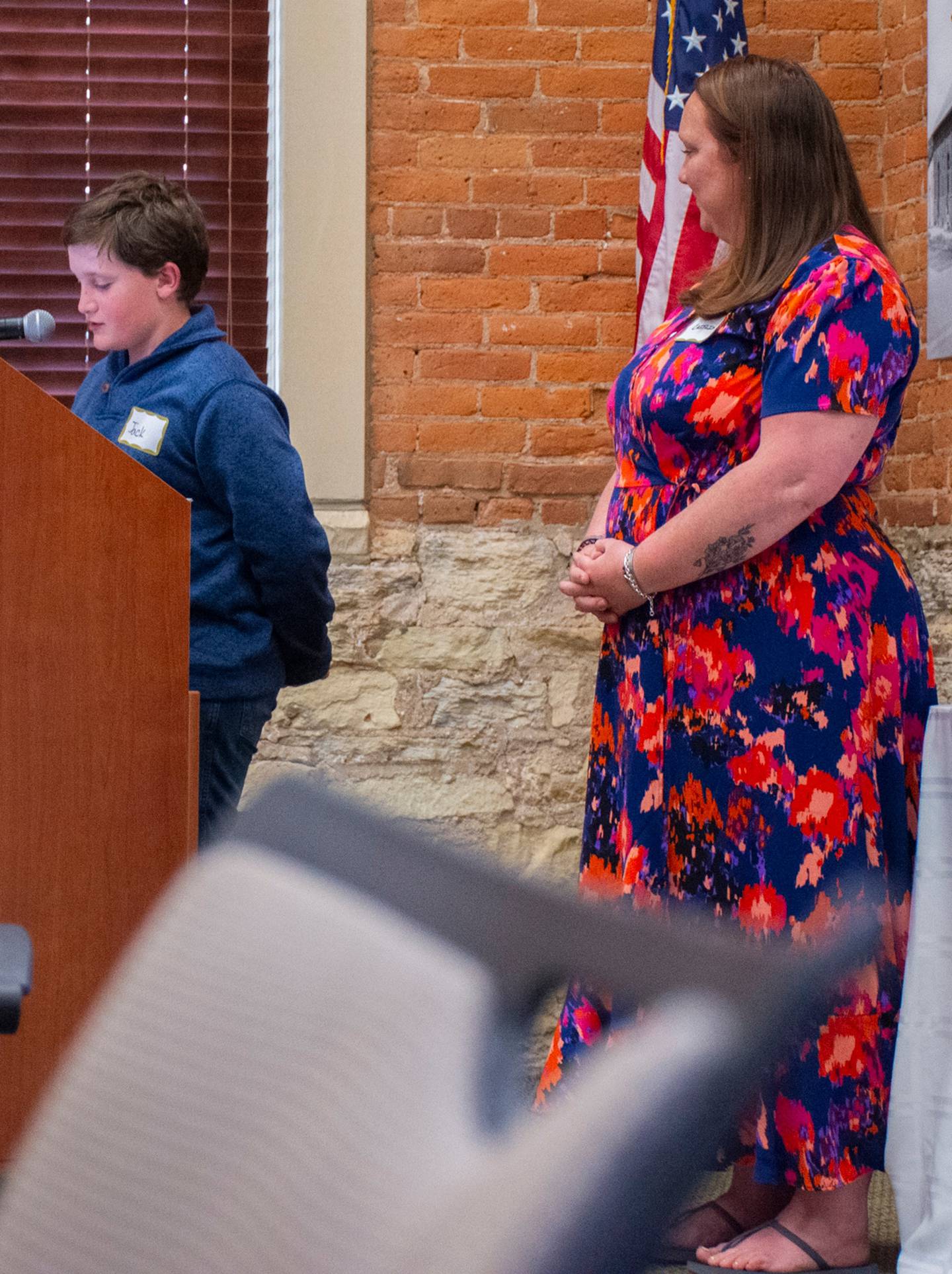 (Left to right); Hiawatha Elementary School student Jack Heinsohn recognizing Caitlin Benes during the 2024 Excellence in Education Awards ceremony