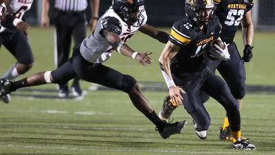 Photos: DeKalb football travels to Aurora for a matchup with Metea Valley
