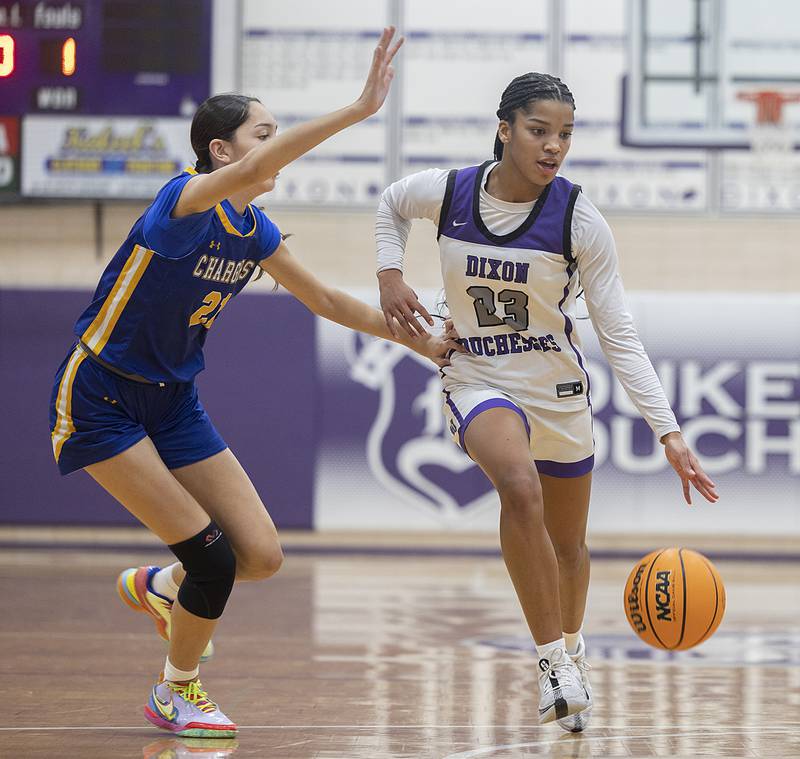 Dixon's Ahmyrie McGowan handles the ball against Aurora Central’s Sofia Orozco Thursday, Dec. 26, 2024, during the Dixon Girl’s KSB Holiday Basketball Classic.