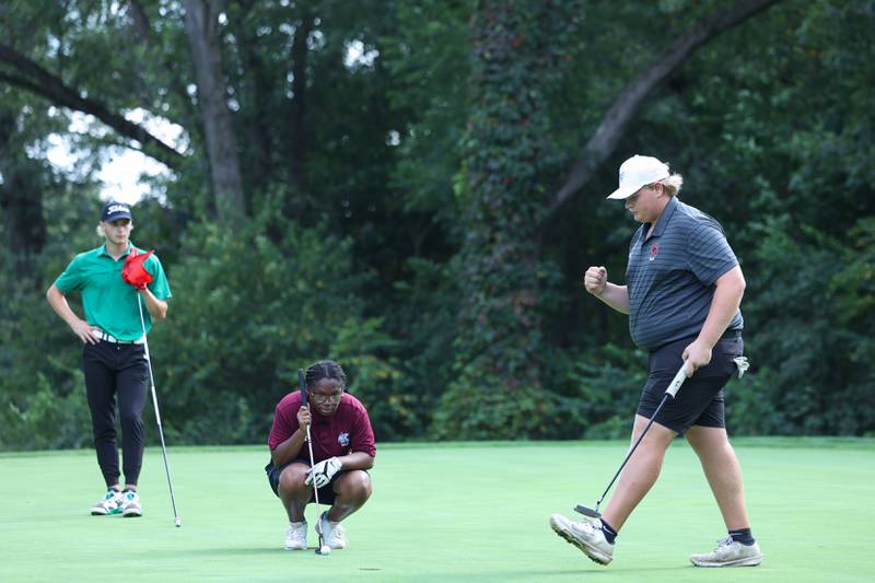 Bradley-Bourbonnais' Kaden Davis, right, celebrates a putt as Bishop McNamara's Braylon Ricketts, left, and Kankakee's Shayla Jordan look on during the All-City matchup on Wednesday, Sept. 24, 2025. Davis and Ricketts would tie for second place with an 84 with the Fightin' Irish earning a 339-342 victory over the Boilermakers.