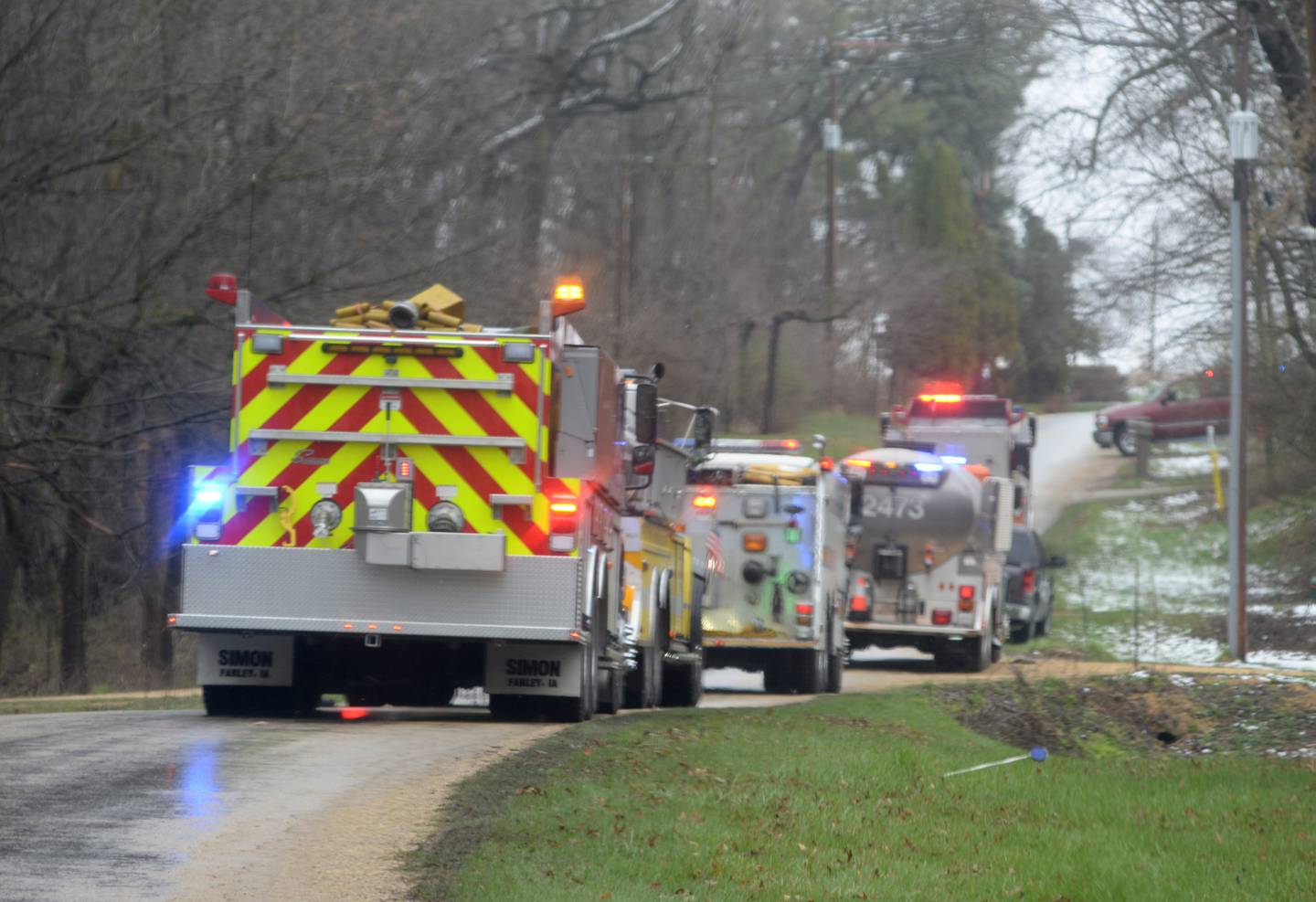 Tanker trucks from several area fire departments were lined up along Lightsville Road on Wednesday, April 3, 2024 as firefighters battled a structure fire at 2990 W. Lightsville Road, northeast of Leaf River. The fire was at the end of a private lane about one mile north of Lighthouse Road.