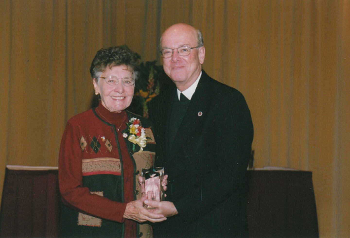 Sister Vivian Whitehead is seen on Sunday, October 17, 2004, receiving an award for outstanding Christian ideals and commendable religious and humanitarian services as founder of the Center for Correctional Concerns in Joliet. Brother James Gaffney, then president of Lewis University in Romeoville, presented the award.