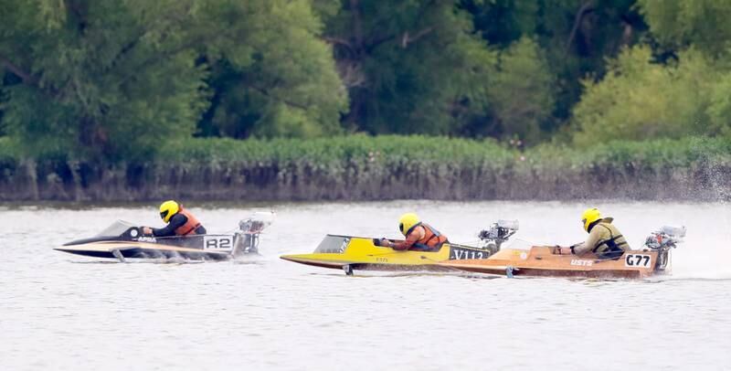 Jonathan Nilsen of Ellensburg Wash., Justin Gibson of Washington, and Braxton Miller of Grove Okla., race in the C Service Hydro during the US Title Series Pro National Championship Boat Races on Saturday, July 27, 2024 at Lake DePue.