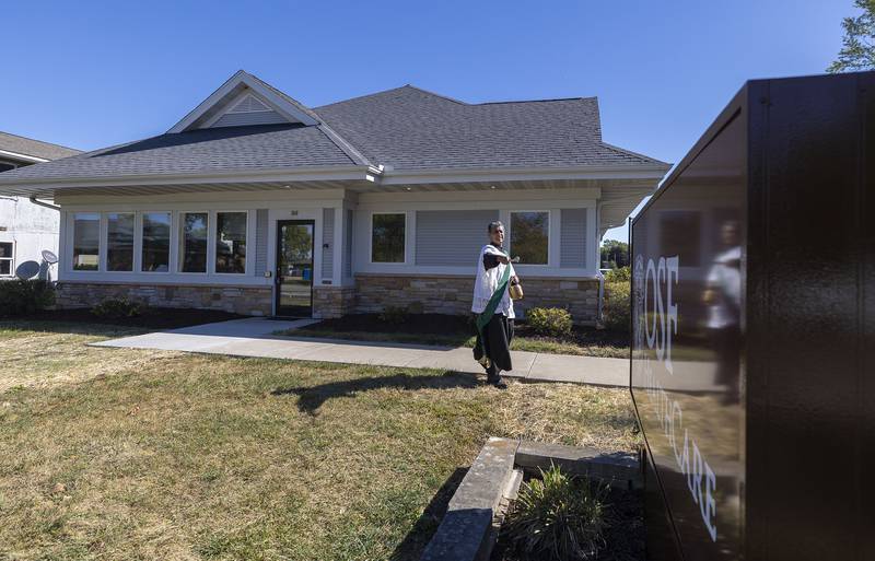 Deacon Armando Regalado blesses the outside of the newest OSF Saint Katharine clinic in Sterling on Wednesday, Oct. 8, 2025.