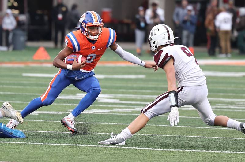 East St. Louis' Robert "Pops" Battle looks to make a move on Prairie Ridge's Joseph Vanderwiel during their IHSA Class 6A state championship game Saturday, Nov. 26, 2022, in Memorial Stadium at the University of Illinois in Champaign.