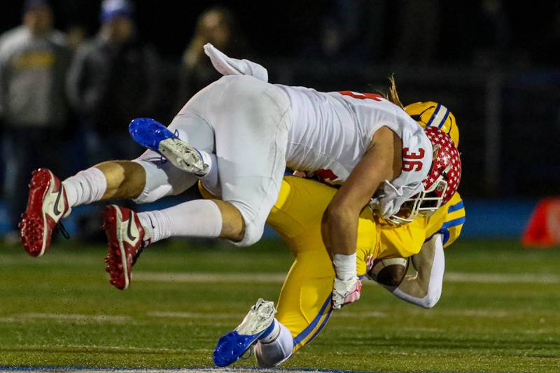 Naperville Central's Daniel Nussbaum (36) comes up with a big hit during Class 8A quarterfinal football game between Naperville Central at Lyons on Friday, Nov 15, 2024  in Western Springs.