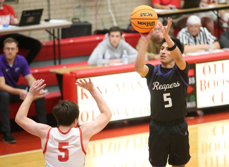 Plano's Alan Contreras shoots a jump shot over Ottawa's Kyler Araujo during the Dean Riley Shootin' The Rock Thanksgiving Tournament on Tuesday, Nov. 26, 2024 in Kingman Gym at Ottawa High School.