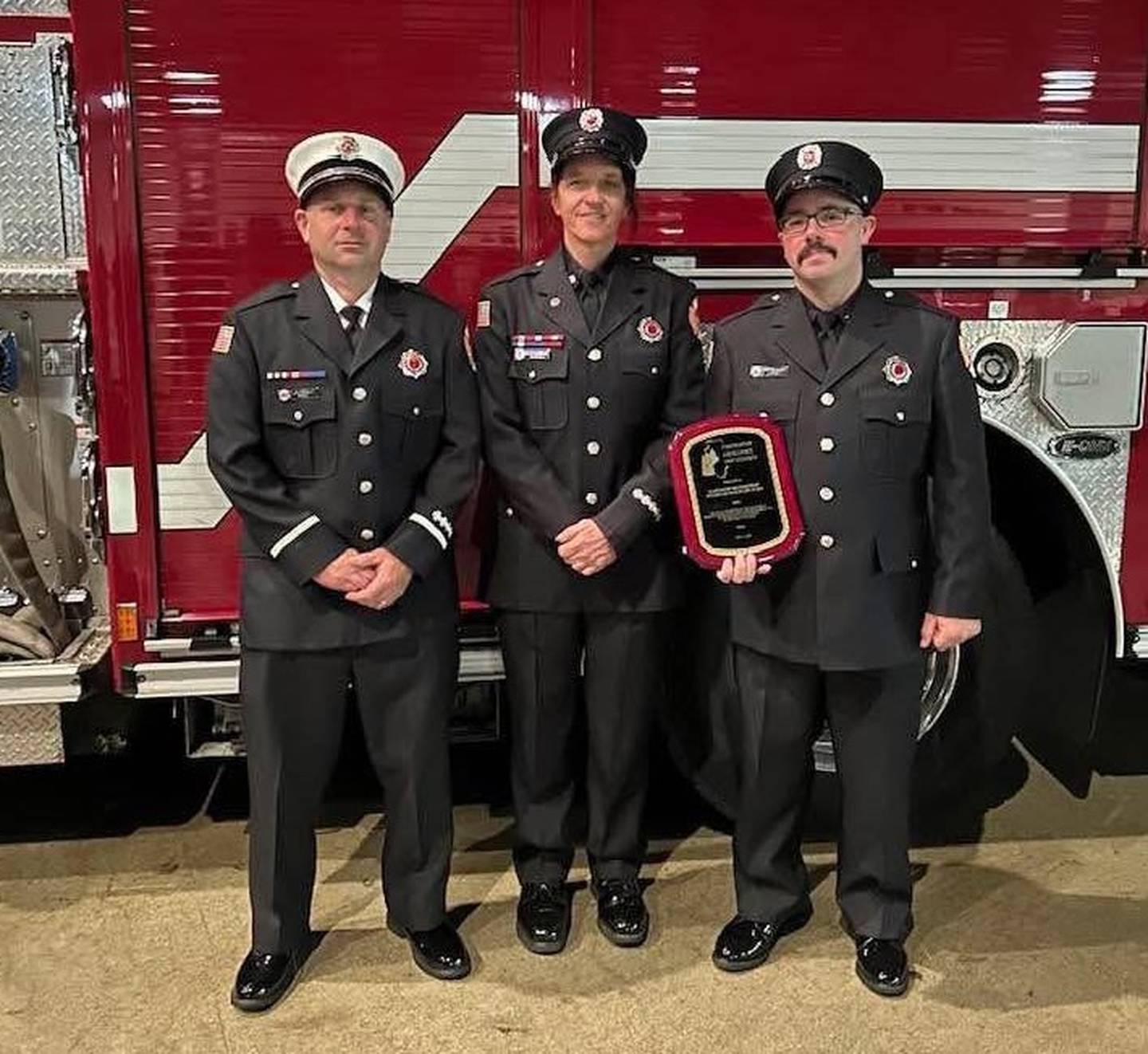 Members of the Bolingbrook Fire Department received the Illinois Firefighter Excellence "Unit Citation" Award at the annual Fallen Firefighter Memorial and Medal of Honor Ceremony in Springfield on Tuesday, May 13, 2025. Picture are from left Lt. Jasson Pech, firefighter/paramedic Tara Moser, and firefighter/paramedic Steven Whited.  Also honored and not pictured is firefighter/paramedic Mark Lyman who as unable to attend.