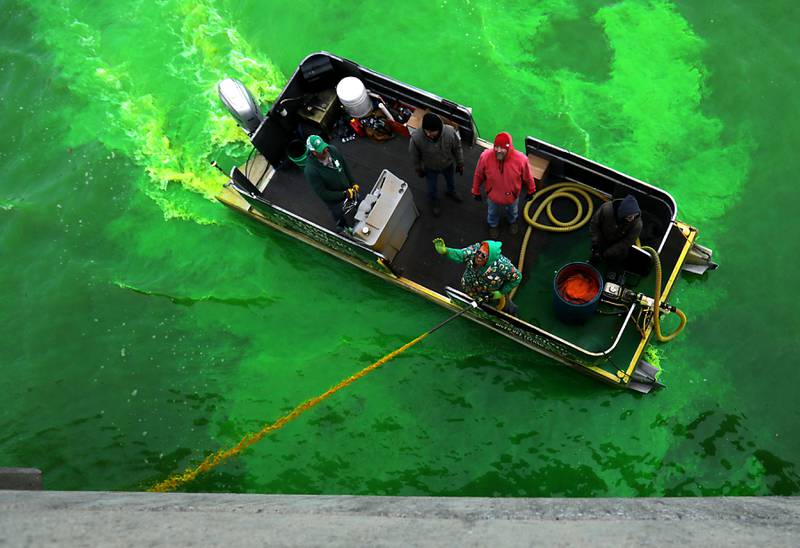 Dye is sprayed into the Fox River to dye the river green during the McHenry’s ShamROCKS the Fox Festival on Saturday, March 14, 2026, in McHenry.